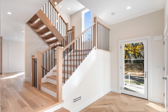 stairs featuring recessed lighting, a healthy amount of sunlight, and baseboards