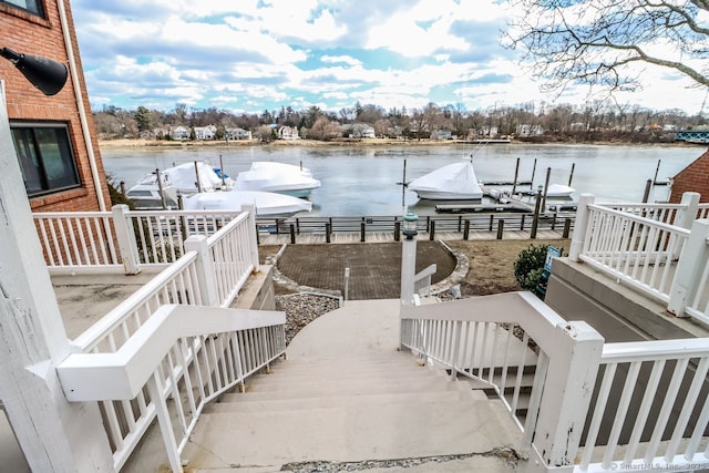 view of dock featuring a water view and boat lift