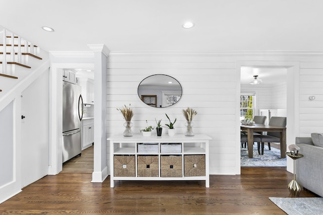 corridor with recessed lighting, dark wood-style floors, stairs, and ornamental molding