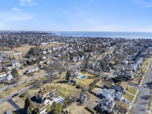 birds eye view of property featuring a water view and a residential view