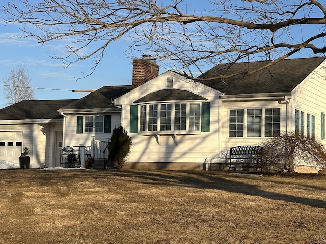 view of property exterior featuring a yard, a chimney, and an attached garage