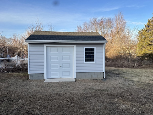 garage with fence