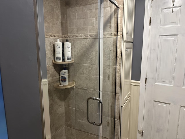 full bath featuring a shower stall