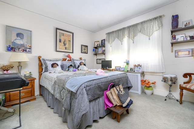 bedroom with carpet flooring and baseboards