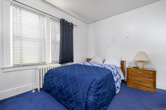 carpeted bedroom with radiator