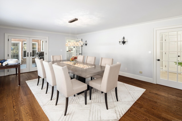 dining room featuring baseboards, french doors, dark wood-type flooring, and crown molding