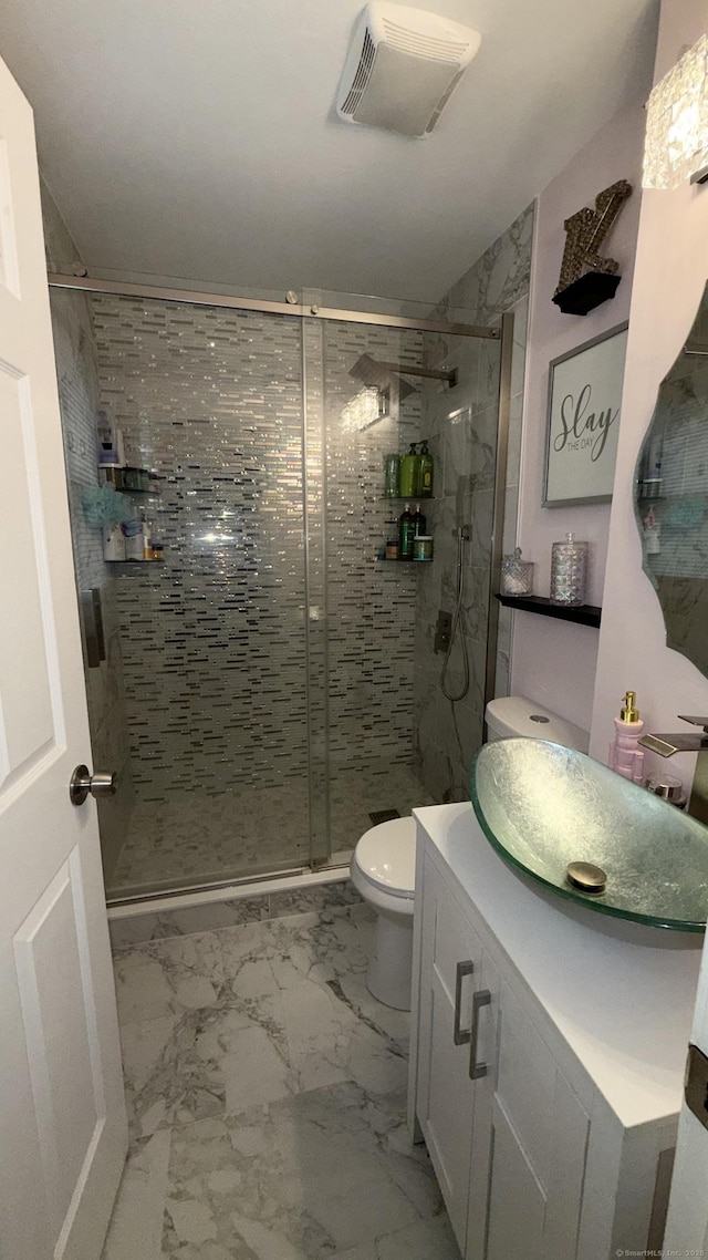 full bathroom featuring visible vents, a shower stall, toilet, marble finish floor, and vanity