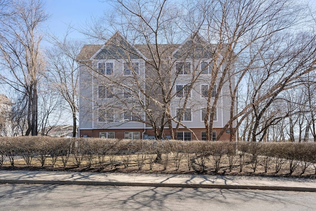 view of front of home featuring brick siding