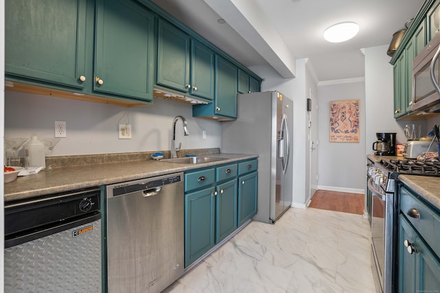 kitchen featuring marble finish floor, stainless steel appliances, ornamental molding, a sink, and baseboards