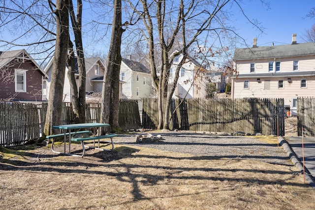 view of yard featuring a residential view and fence