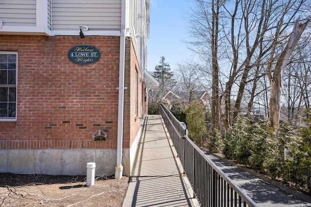 view of side of home with brick siding