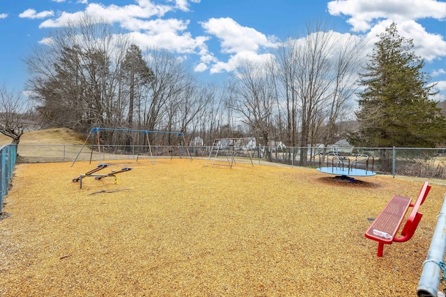 view of yard with playground community and fence