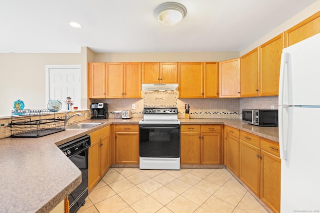 kitchen featuring dishwasher, stainless steel microwave, freestanding refrigerator, a sink, and range with electric stovetop