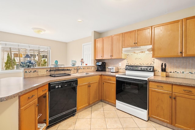 kitchen featuring under cabinet range hood, electric range, a sink, black dishwasher, and tasteful backsplash