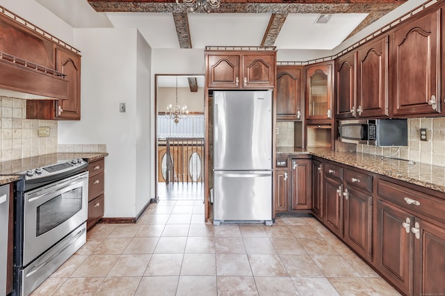 kitchen featuring light stone countertops, tasteful backsplash, visible vents, and stainless steel appliances