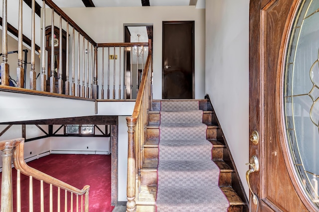 stairway featuring carpet