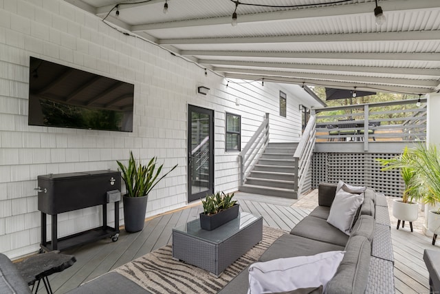 deck featuring stairs and an outdoor living space