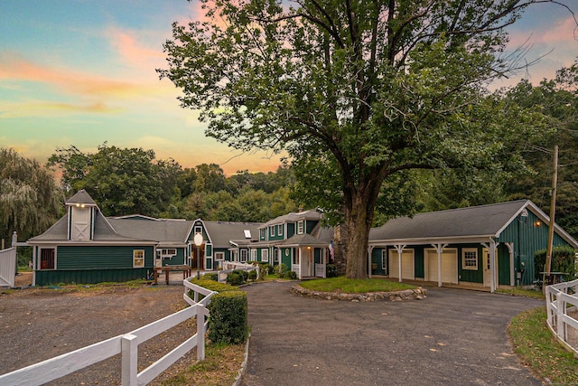 view of front of house featuring fence