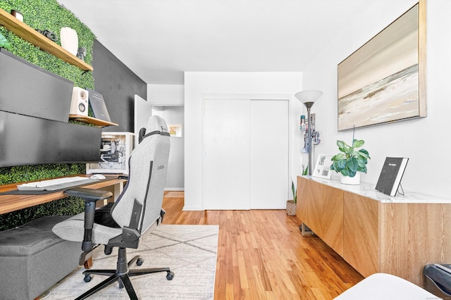 home office with light wood finished floors