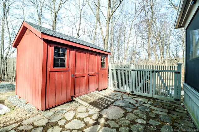 view of shed with fence