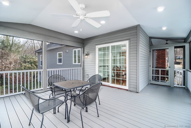 wooden deck with a ceiling fan and outdoor dining area