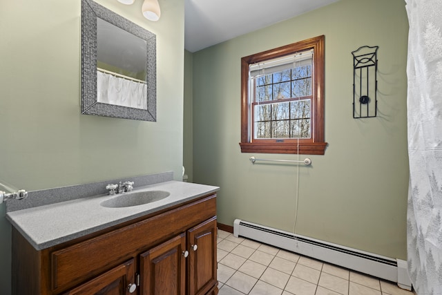 bathroom featuring vanity, a baseboard heating unit, and tile patterned floors