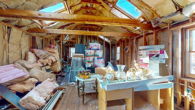 miscellaneous room with vaulted ceiling, hardwood / wood-style floors, and a wealth of natural light