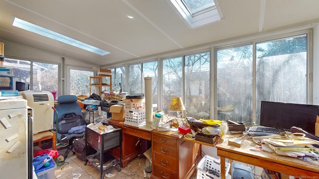 office space featuring lofted ceiling with skylight and tile patterned floors