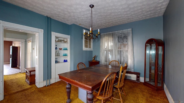 dining area with carpet floors, arched walkways, an inviting chandelier, a textured ceiling, and baseboards