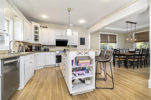 kitchen featuring stainless steel appliances, backsplash, and white cabinetry