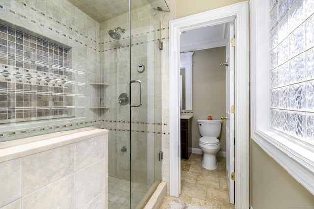 bathroom with baseboards, a shower stall, and toilet