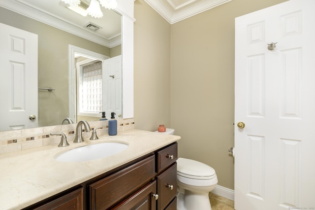 bathroom with visible vents, toilet, ornamental molding, vanity, and tile patterned floors