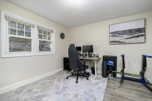 office featuring baseboards and wood finished floors