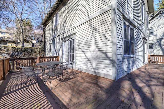 wooden deck with outdoor dining area