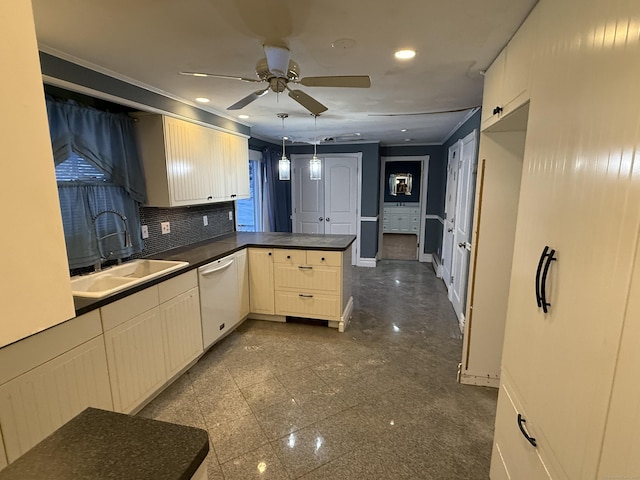 kitchen featuring a peninsula, granite finish floor, a sink, dishwasher, and tasteful backsplash