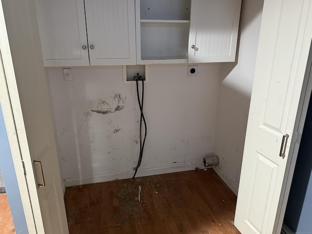 laundry area with washer hookup, cabinet space, electric dryer hookup, and wood finished floors