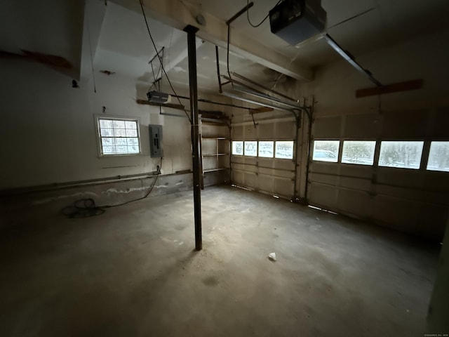 garage featuring a garage door opener and electric panel