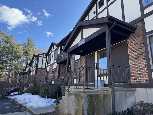 view of property exterior featuring brick siding