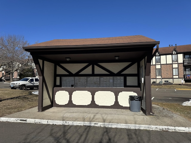 view of parking featuring mail area