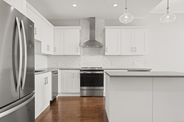 kitchen featuring white cabinetry, wall chimney exhaust hood, appliances with stainless steel finishes, and dark wood-style flooring