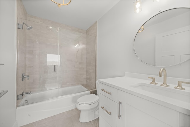 bathroom featuring tile patterned flooring, shower / bath combination with glass door, vanity, and toilet