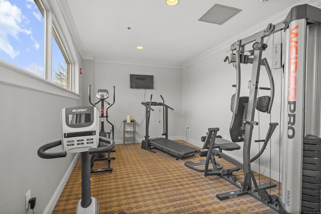 workout room with baseboards and ornamental molding