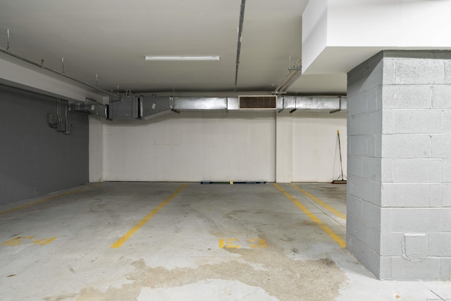 parking deck featuring concrete block wall