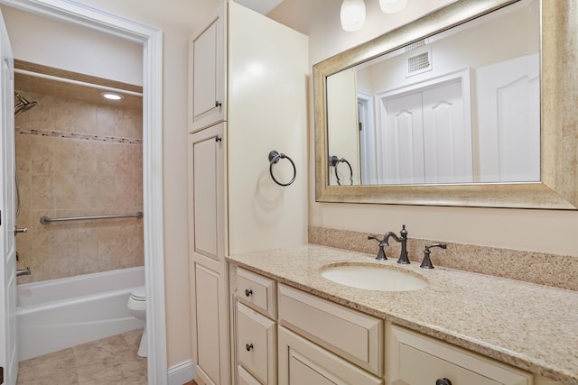 bathroom with bathtub / shower combination, visible vents, vanity, and toilet