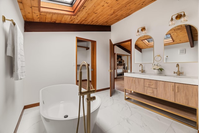 full bathroom with wood ceiling, marble finish floor, a sink, and double vanity