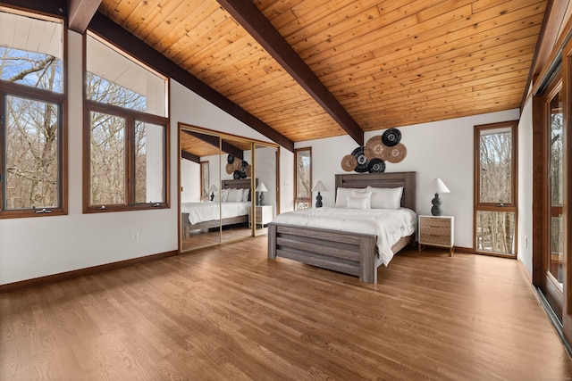 unfurnished bedroom featuring wood ceiling, wood finished floors, high vaulted ceiling, beamed ceiling, and baseboards