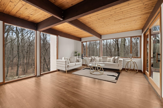 unfurnished sunroom with wood ceiling and beamed ceiling