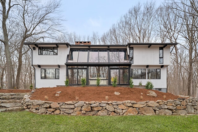 back of property featuring a sunroom