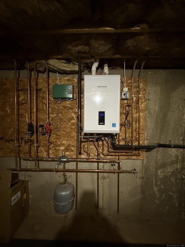 utility room featuring water heater