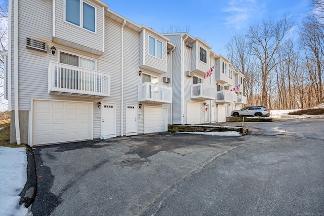 view of property with driveway and an attached garage